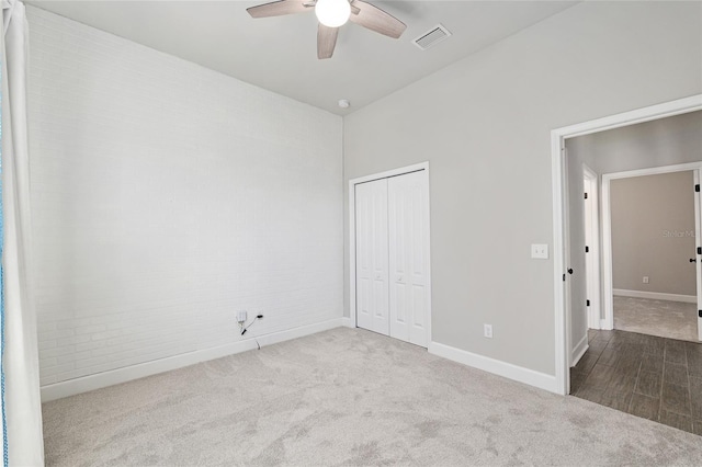 2556 SW 118th Ter, Gainesville, FL 32608 - unfurnished bedroom with carpet flooring, a closet, and a ceiling fan