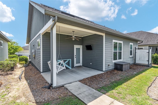 2556 SW 118th Ter, Gainesville, FL 32608 - back of house featuring ceiling fan and a patio area