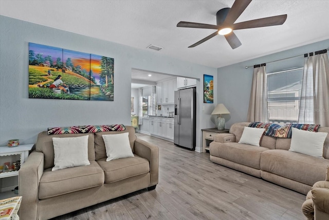 4444 5th Ave S, Saint Petersburg, FL 33711 - living area with ceiling fan and light wood finished floors