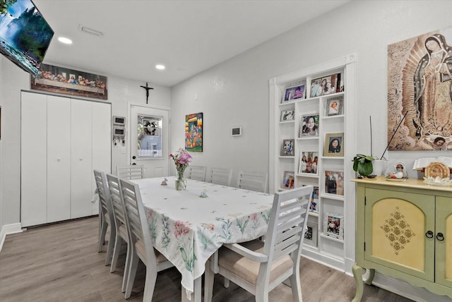4444 5th Ave S, Saint Petersburg, FL 33711 - dining room with light wood-style floors and recessed lighting