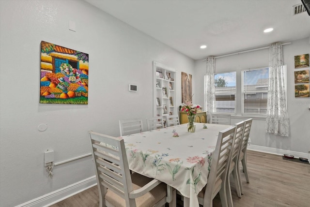 4444 5th Ave S, Saint Petersburg, FL 33711 - dining area with wood finished floors and recessed lighting