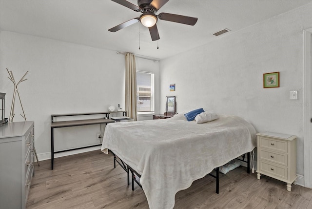 4444 5th Ave S, Saint Petersburg, FL 33711 - bedroom featuring light wood-style flooring and ceiling fan