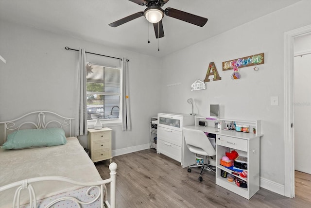 4444 5th Ave S, Saint Petersburg, FL 33711 - bedroom with wood finished floors, a ceiling fan, and a desk