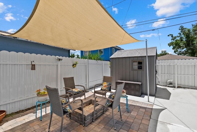 4444 5th Ave S, Saint Petersburg, FL 33711 - fenced backyard with a patio and a storage unit