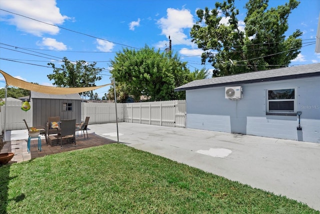 4444 5th Ave S, Saint Petersburg, FL 33711 - fenced backyard featuring a patio area, a gate, and an outbuilding