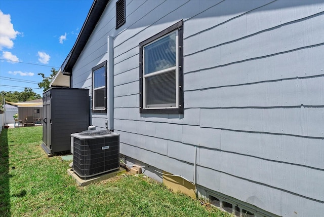 4444 5th Ave S, Saint Petersburg, FL 33711 - view of property exterior with a cooling unit and a yard