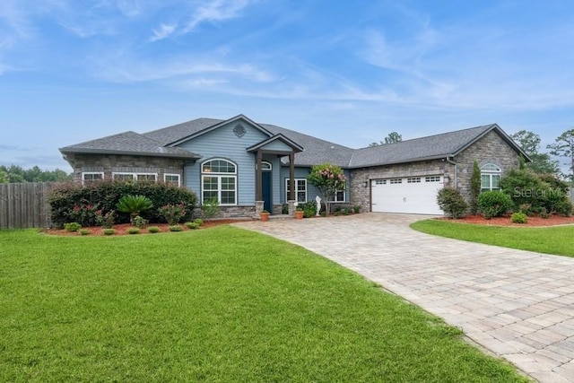 6813 SW 83rd Ter, Lake Butler, FL 32054 - single story home featuring stone siding, decorative driveway, a garage, and roof with shingles