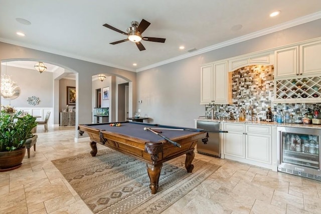 6813 SW 83rd Ter, Lake Butler, FL 32054 - game room with wine cooler, bar, arched walkways, ceiling fan, and stone tile floors