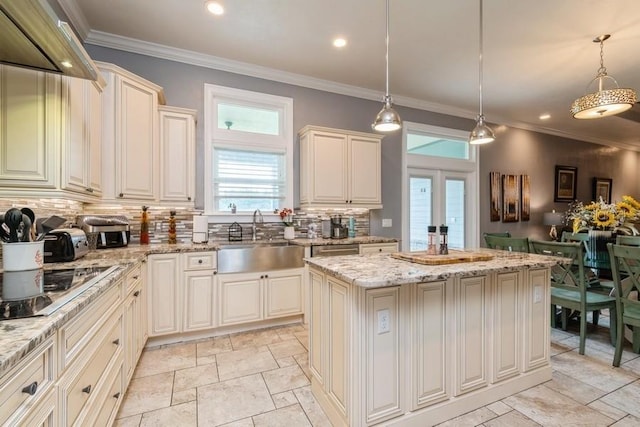 6813 SW 83rd Ter, Lake Butler, FL 32054 - kitchen with decorative backsplash, a kitchen island, light stone counters, stone tile flooring, and recessed lighting