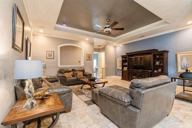 6813 SW 83rd Ter, Lake Butler, FL 32054 - living area with a tray ceiling, ceiling fan, crown molding, and stone tile flooring