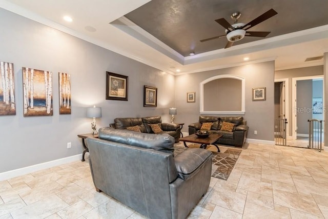 6813 SW 83rd Ter, Lake Butler, FL 32054 - living area with a tray ceiling, stone tile flooring, crown molding, ceiling fan, and recessed lighting