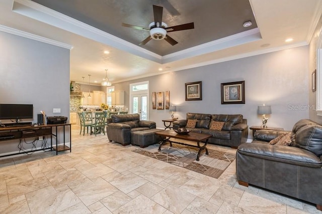 6813 SW 83rd Ter, Lake Butler, FL 32054 - living room featuring a tray ceiling, a ceiling fan, ornamental molding, stone tile floors, and recessed lighting