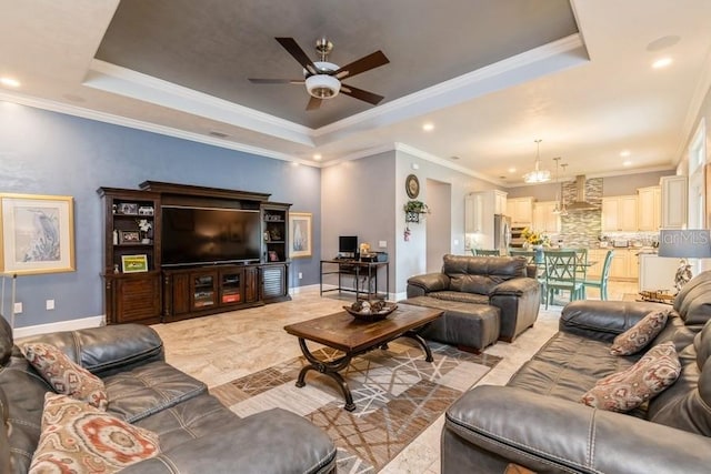 6813 SW 83rd Ter, Lake Butler, FL 32054 - living room featuring a raised ceiling, a ceiling fan, ornamental molding, and recessed lighting