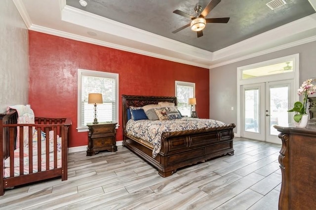 6813 SW 83rd Ter, Lake Butler, FL 32054 - bedroom with a tray ceiling, multiple windows, and crown molding
