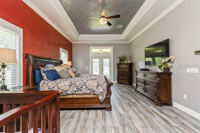 6813 SW 83rd Ter, Lake Butler, FL 32054 - bedroom featuring a raised ceiling, light wood-style floors, french doors, access to outside, and ceiling fan