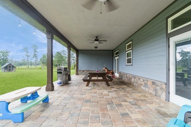 6813 SW 83rd Ter, Lake Butler, FL 32054 - view of patio / terrace with a ceiling fan and grilling area
