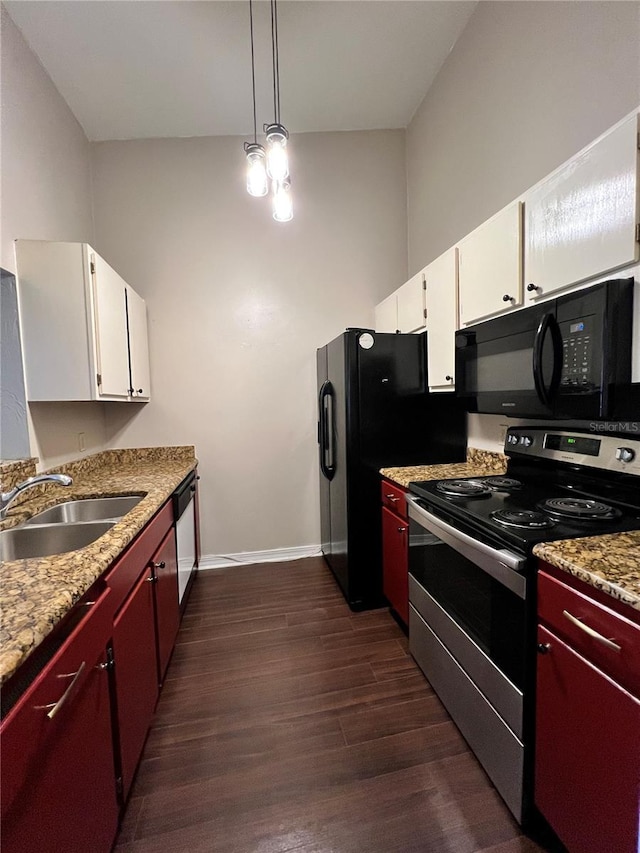 2360 SW Archer Rd Unit 719, Gainesville, FL 32608 - kitchen featuring black appliances, dark wood-style floors, white cabinetry, and light countertops