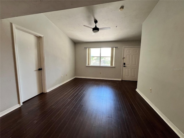 2360 SW Archer Rd Unit 719, Gainesville, FL 32608 - spare room featuring dark wood finished floors, a ceiling fan, and a smoke detector