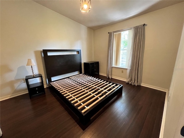 2360 SW Archer Rd Unit 719, Gainesville, FL 32608 - bedroom with dark wood-style floors and vaulted ceiling