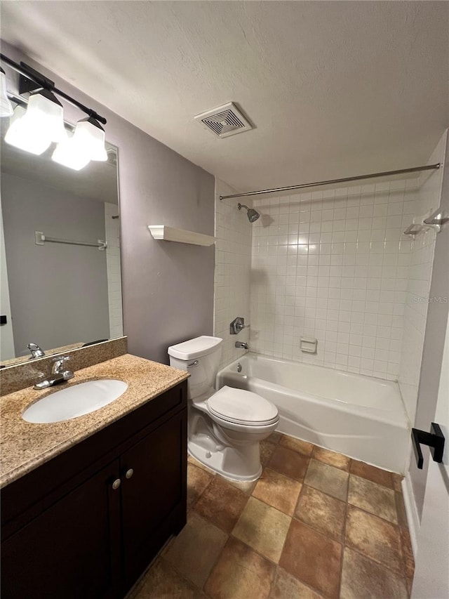 2360 SW Archer Rd Unit 719, Gainesville, FL 32608 - bathroom featuring vanity, shower / bathtub combination, stone finish flooring, and a textured ceiling