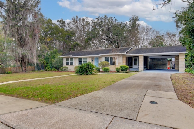1318 NW 7th Rd, Gainesville, FL 32603 - single story home with brick siding, driveway, and an attached carport