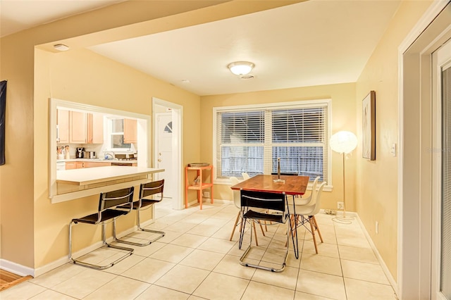 1318 NW 7th Rd, Gainesville, FL 32603 - dining area with light tile patterned flooring and baseboards