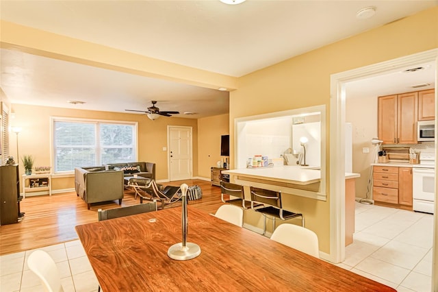 1318 NW 7th Rd, Gainesville, FL 32603 - dining area featuring light tile patterned flooring and ceiling fan