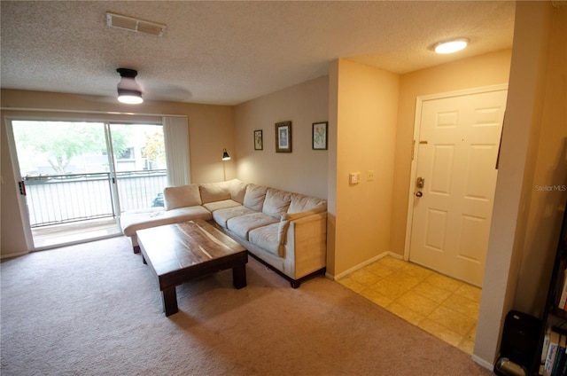 3705 SW 27th St Unit 223, Gainesville, FL 32608 - living room with light carpet, a textured ceiling, and a ceiling fan