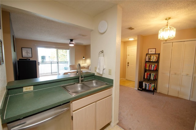 3705 SW 27th St Unit 223, Gainesville, FL 32608 - kitchen with dishwasher, light carpet, a textured ceiling, a chandelier, and dark countertops