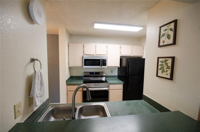 3705 SW 27th St Unit 223, Gainesville, FL 32608 - kitchen featuring freestanding refrigerator, stainless steel electric stove, white microwave, dark countertops, and a textured wall