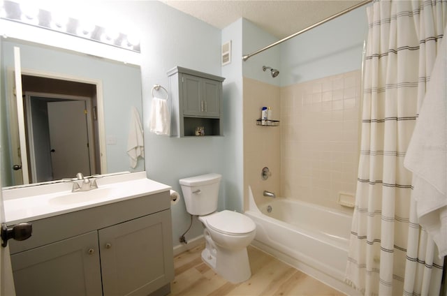 3705 SW 27th St Unit 223, Gainesville, FL 32608 - bathroom with vanity, shower / bath combination with curtain, wood finished floors, and a textured ceiling