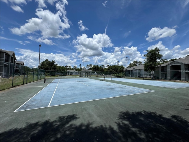 3705 SW 27th St Unit 223, Gainesville, FL 32608 - view of tennis court featuring a residential view
