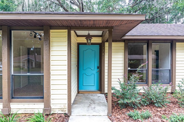 1745 NW 42nd Ave, Gainesville, FL 32605 - property entrance with a shingled roof
