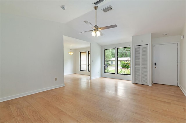 1745 NW 42nd Ave, Gainesville, FL 32605 - spare room featuring lofted ceiling, ceiling fan, and light wood-style flooring