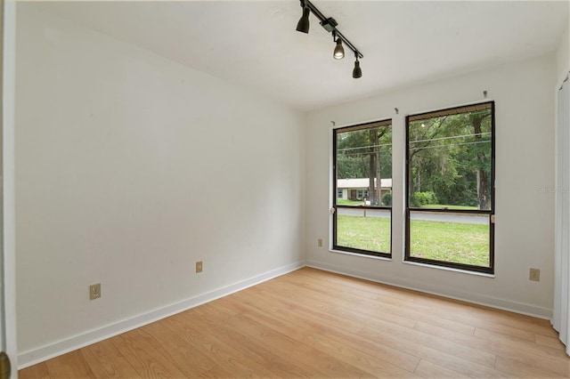 1745 NW 42nd Ave, Gainesville, FL 32605 - unfurnished room with track lighting and light wood-style flooring