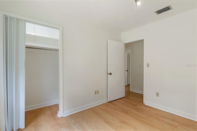 1745 NW 42nd Ave, Gainesville, FL 32605 - unfurnished bedroom with light wood-type flooring and a closet