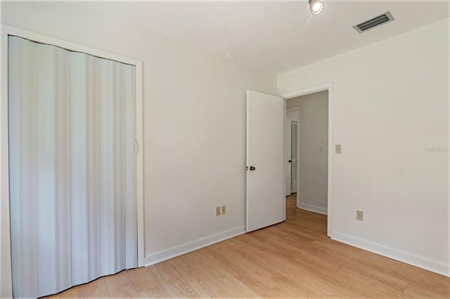 1745 NW 42nd Ave, Gainesville, FL 32605 - unfurnished bedroom featuring light wood-style flooring and baseboards