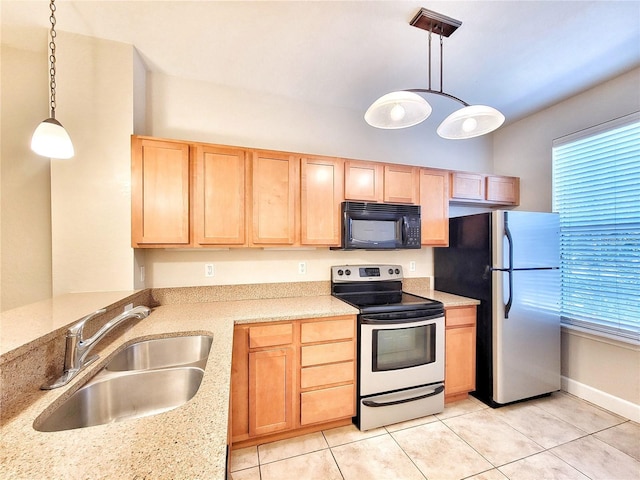 2508 SW 35th Pl Unit L-70, Gainesville, FL 32608 - kitchen with stainless steel appliances, light brown cabinetry, light tile patterned flooring, and healthy amount of natural light