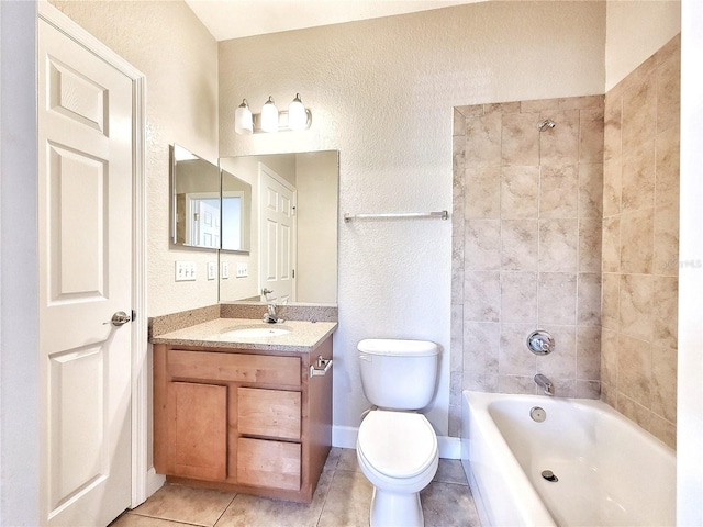 2508 SW 35th Pl Unit L-70, Gainesville, FL 32608 - bathroom featuring tile patterned flooring, vanity, a textured wall, and shower / tub combination