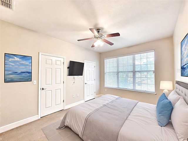 2508 SW 35th Pl Unit L-70, Gainesville, FL 32608 - bedroom featuring light carpet and a ceiling fan
