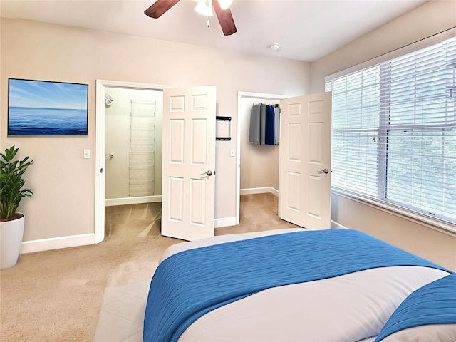 2508 SW 35th Pl Unit L-70, Gainesville, FL 32608 - bedroom featuring light colored carpet, a walk in closet, and ceiling fan