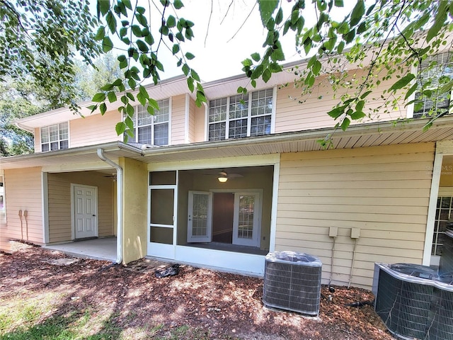 2508 SW 35th Pl Unit L-70, Gainesville, FL 32608 - back of house featuring a sunroom and a patio area