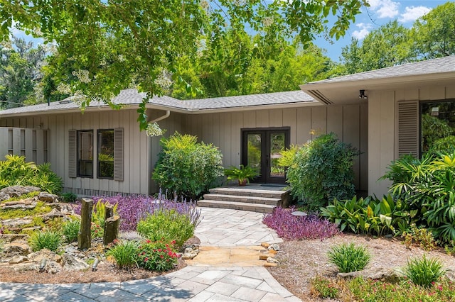 6501 NW 16th Pl, Gainesville, FL 32605 - property entrance featuring french doors and a shingled roof