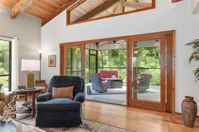 6501 NW 16th Pl, Gainesville, FL 32605 - living area featuring french doors, a wooden ceiling with exposed beams, hardwood / wood-style floors, ceiling fan, and high vaulted ceiling