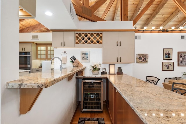6501 NW 16th Pl, Gainesville, FL 32605 - indoor dry bar featuring wine cooler, wooden ceiling, double oven, and wood finished floors