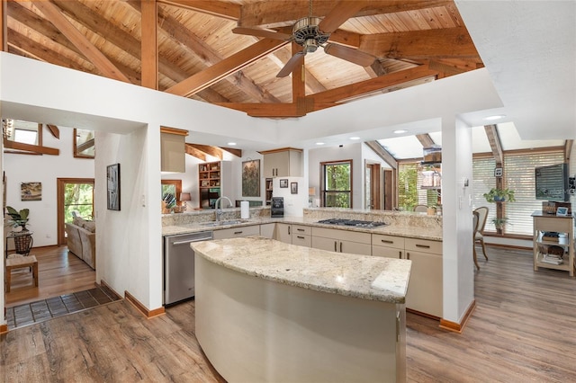 6501 NW 16th Pl, Gainesville, FL 32605 - kitchen with appliances with stainless steel finishes, ceiling fan, light wood finished floors, a wooden ceiling with exposed beams, and a kitchen island