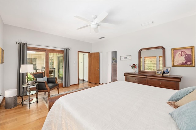 6501 NW 16th Pl, Gainesville, FL 32605 - bedroom with light wood-style floors, access to outside, and ceiling fan