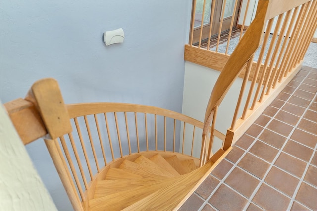 6501 NW 16th Pl, Gainesville, FL 32605 - stairway featuring tile patterned flooring