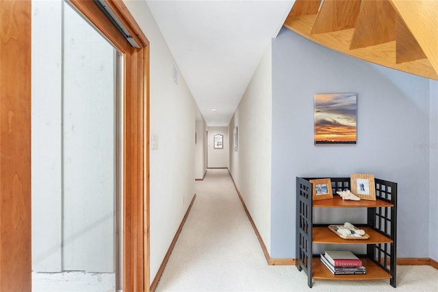 6501 NW 16th Pl, Gainesville, FL 32605 - hallway with baseboards and light carpet
