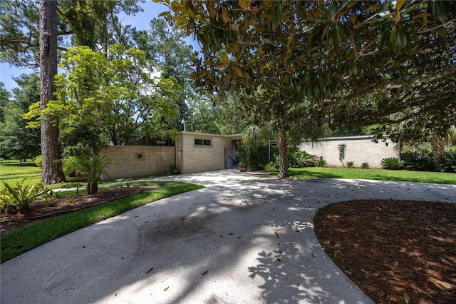 2010 NW 32nd Ter, Gainesville, FL 32605 - mid-century modern home with concrete driveway and brick siding